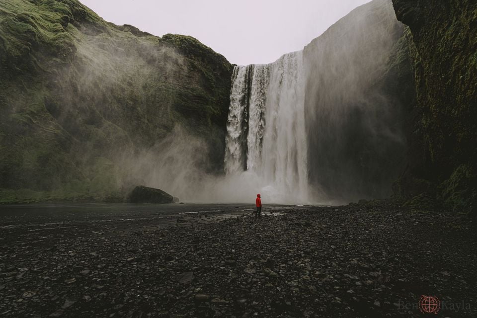 Waterfalls and man in Red jacket